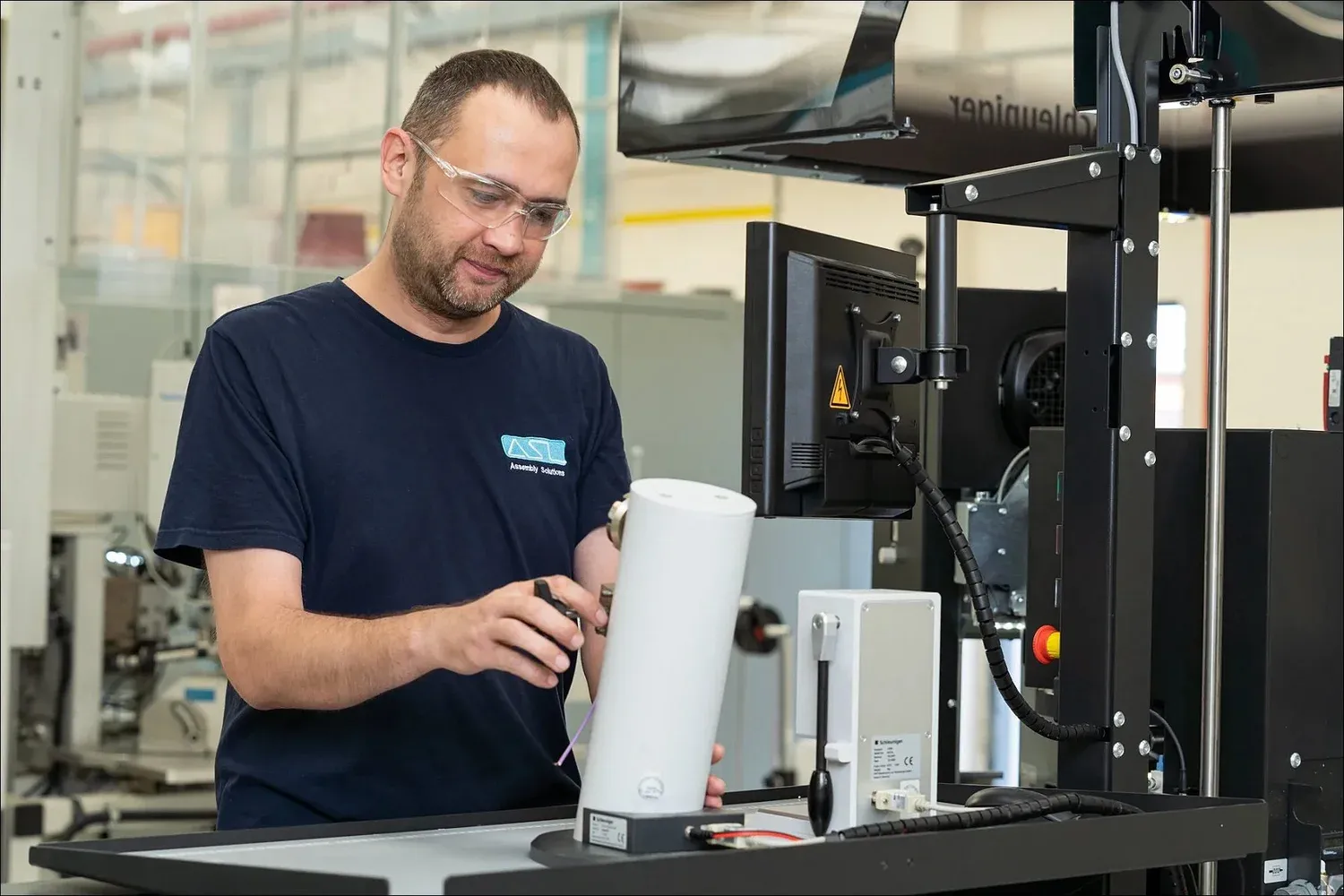 Precision assembly technician at an ASL workstation