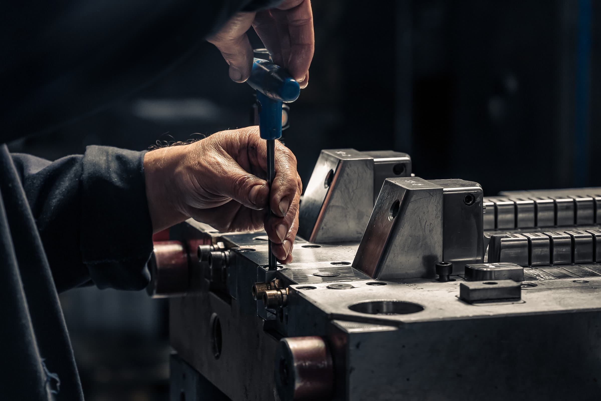 Precision hand-tool work on a metal mould at AC Plastics