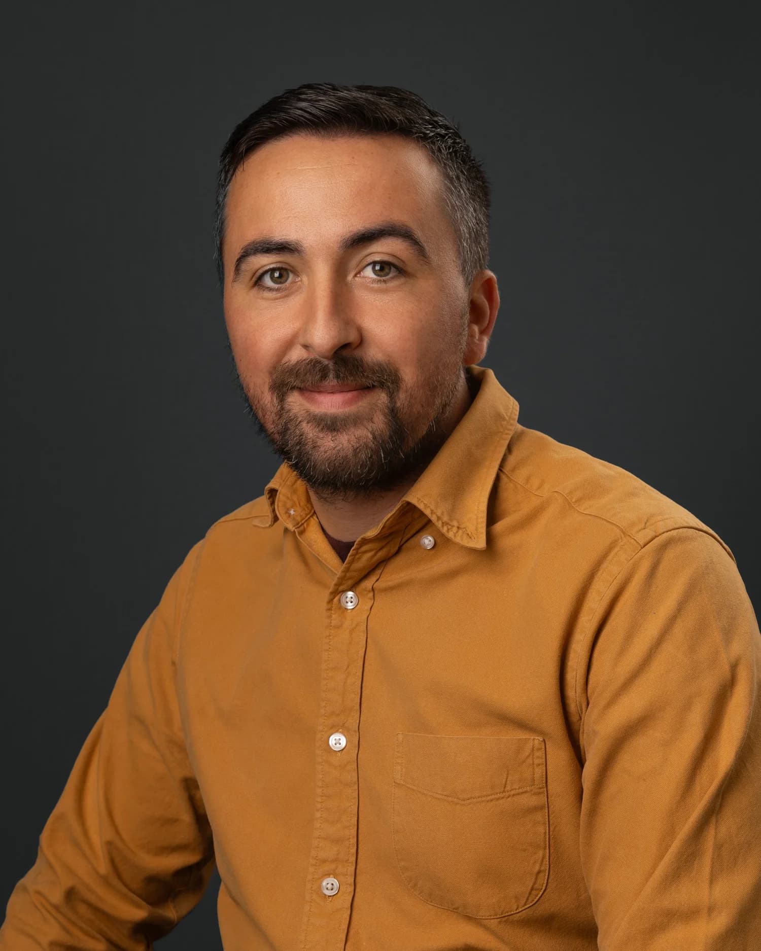Professional corporate headshot on a clean studio background