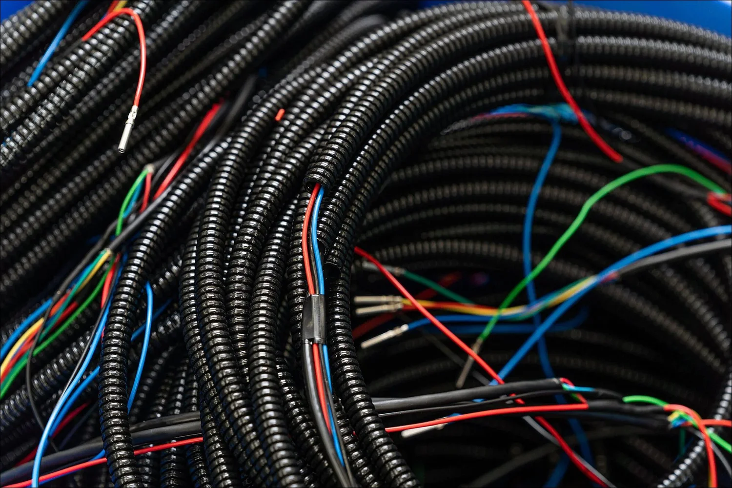 Black convoluted conduit wiring assembly production