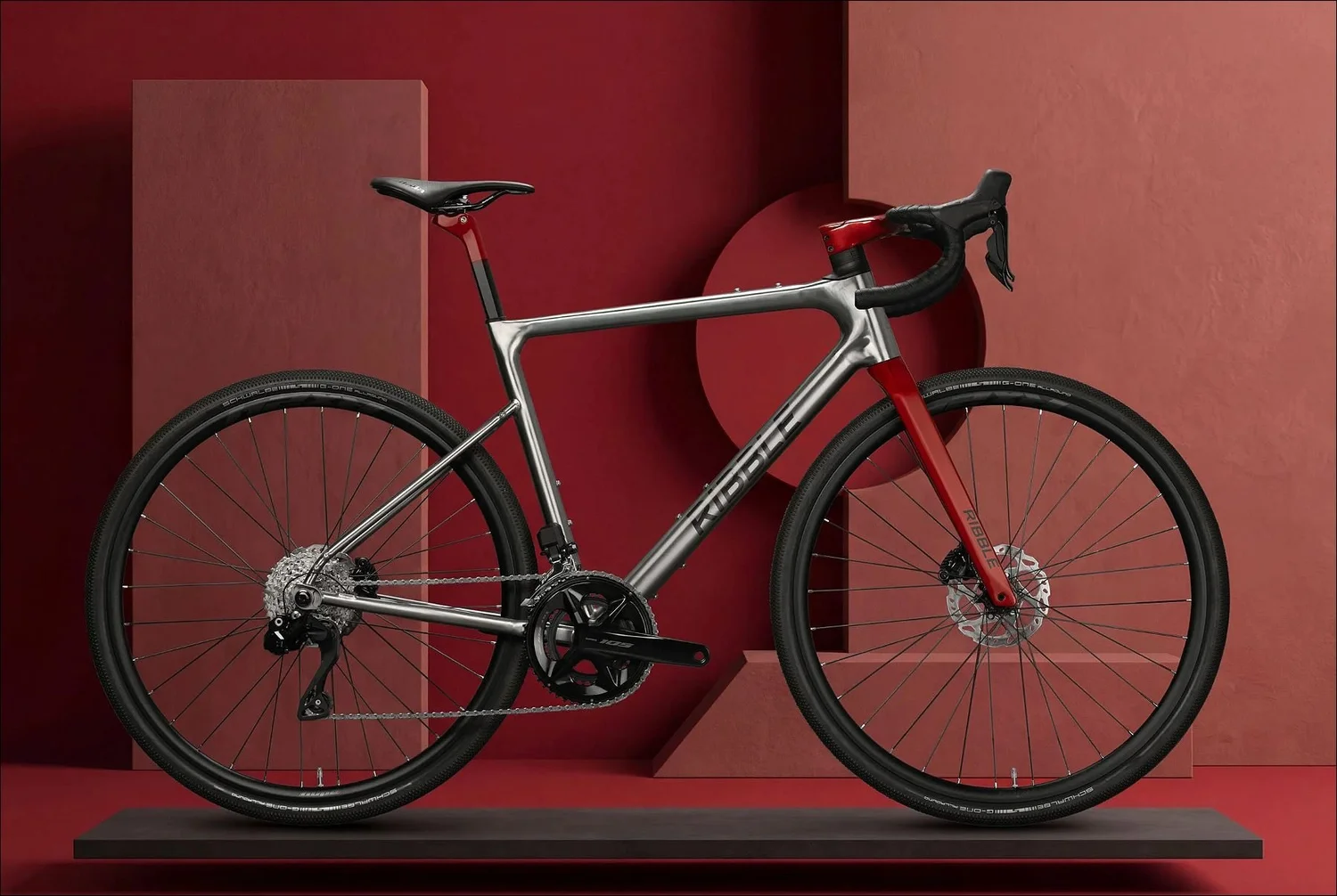 Raw titanium Ribble bike with red CustomColour fork and seatpost on a crimson set