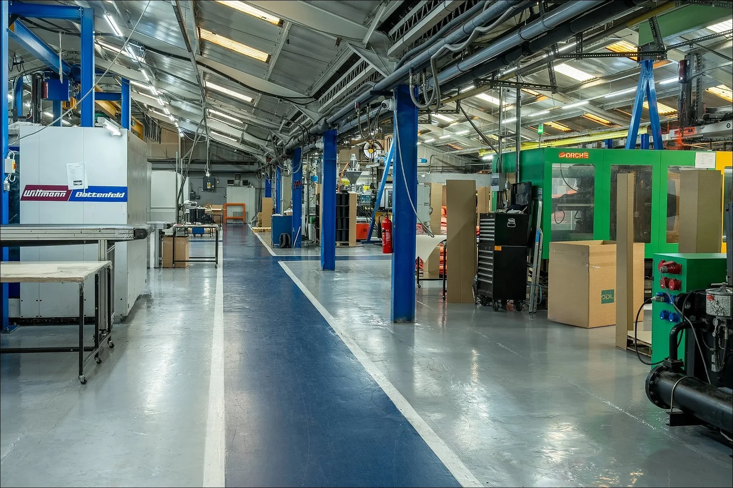 Grey blue painted industrial floor factory interior