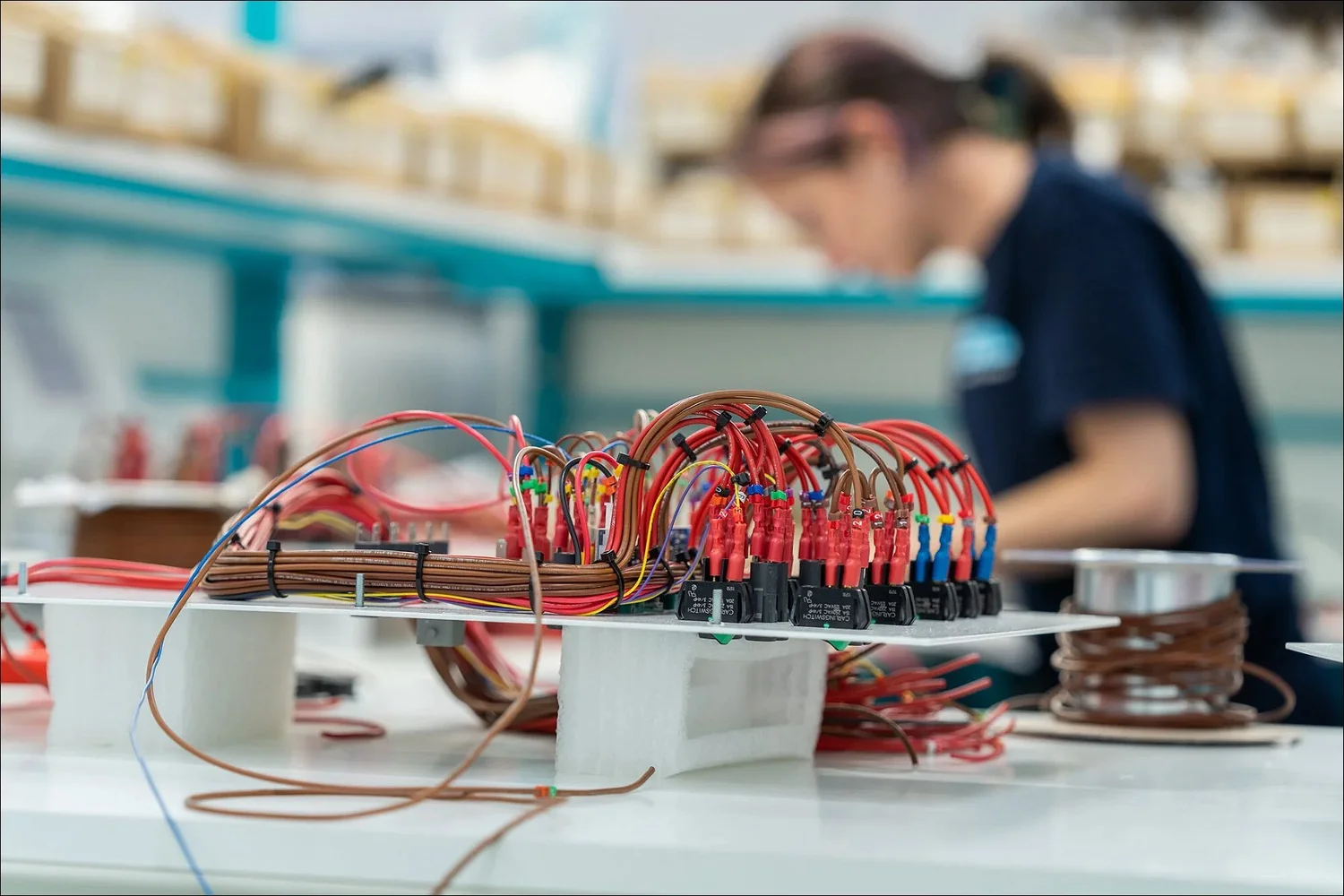 Bundled electrical wiring harness on foam support manufacturing