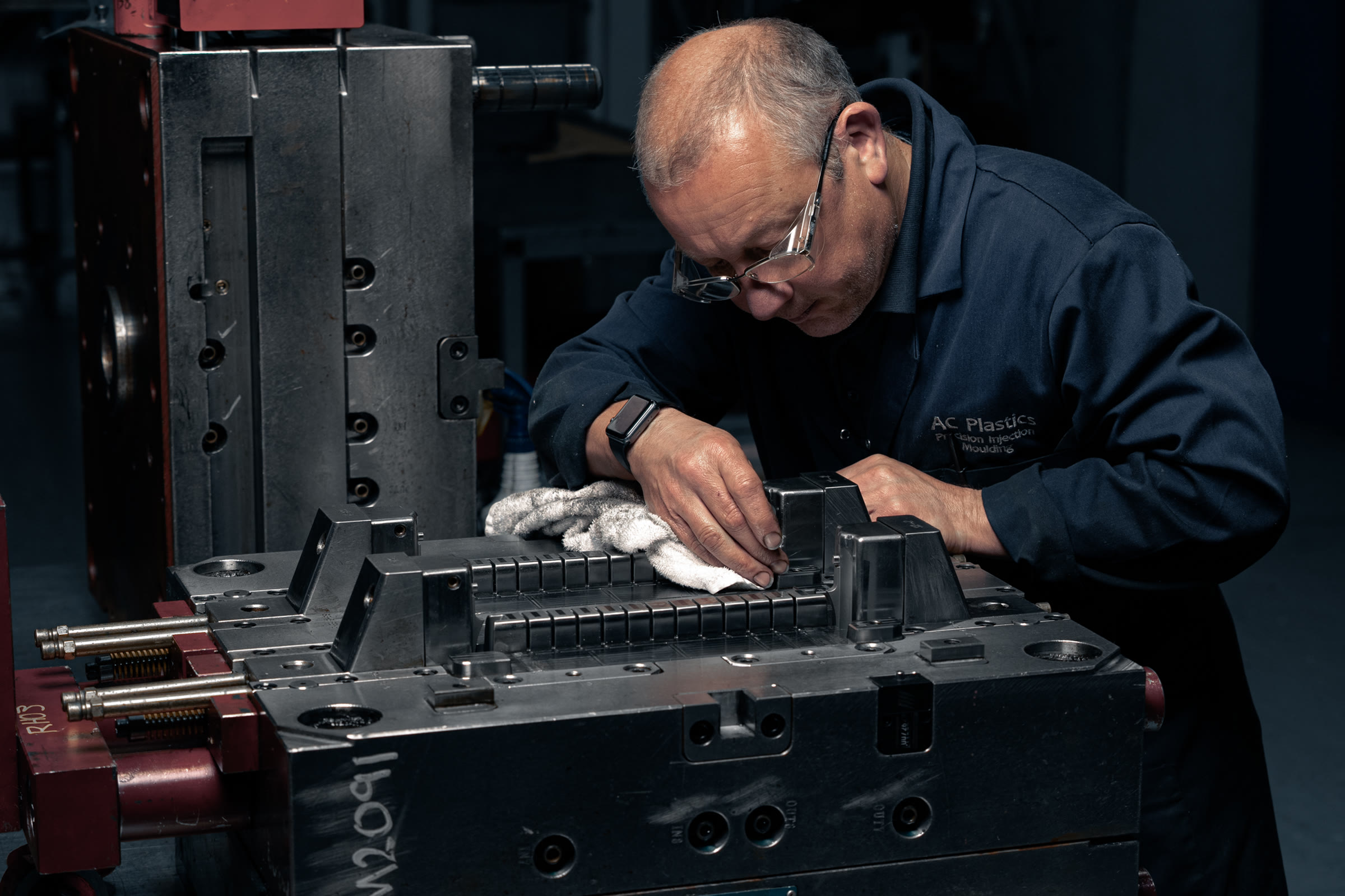 AC Plastics technician carrying out detailed work on a mould tool