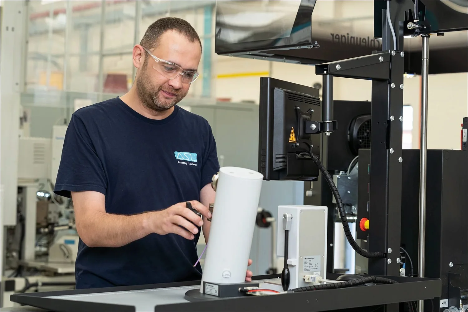 Precision assembly technician at an ASL workstation